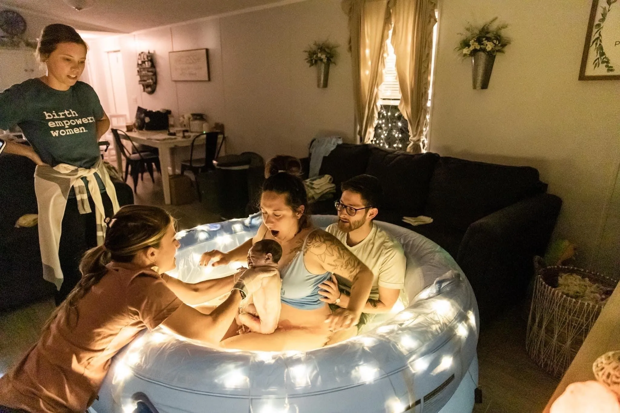 Parents embracing with newborn
